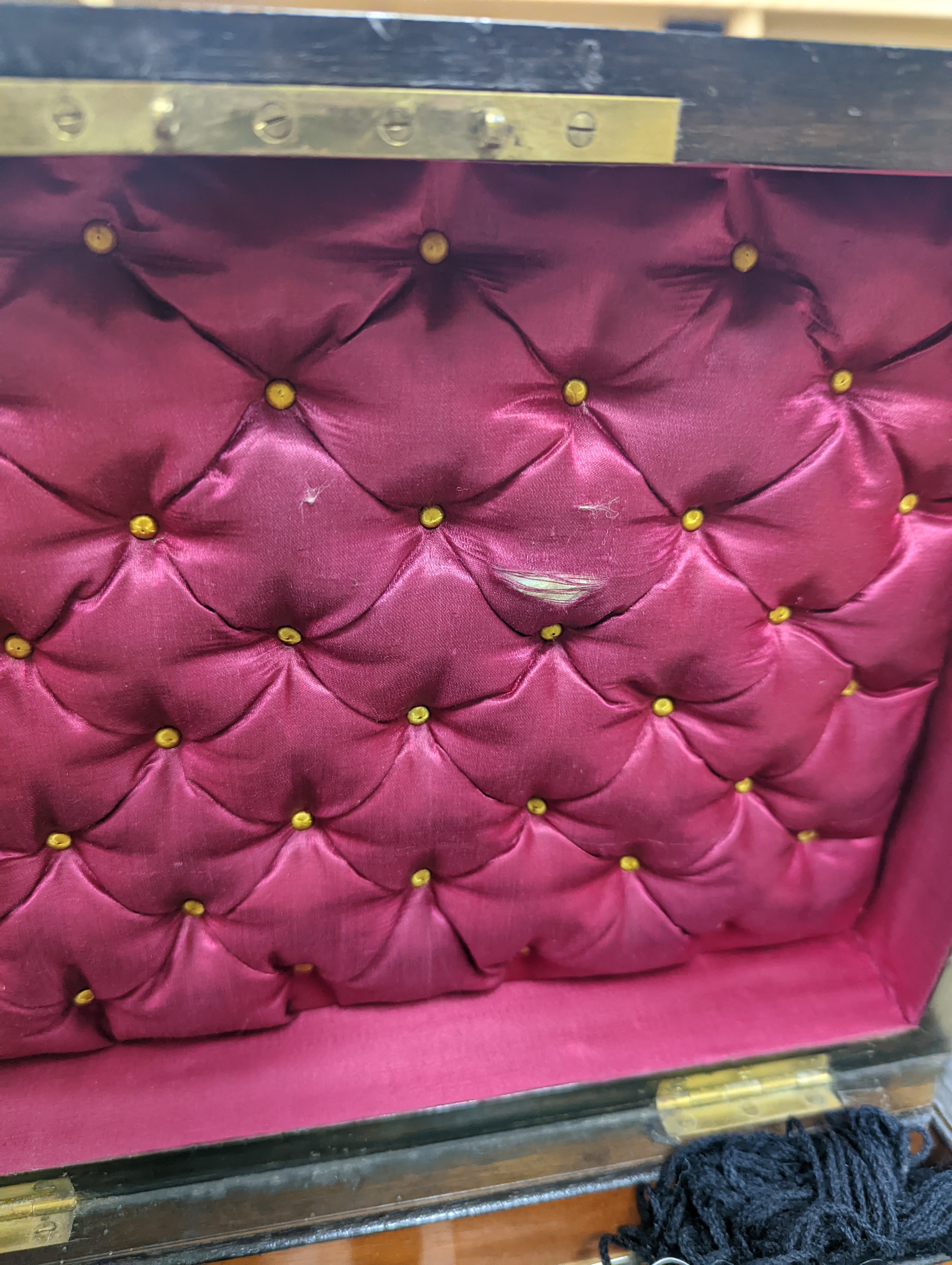 A Victorian walnut sewing casket, 34cm, containing sewing related accessories